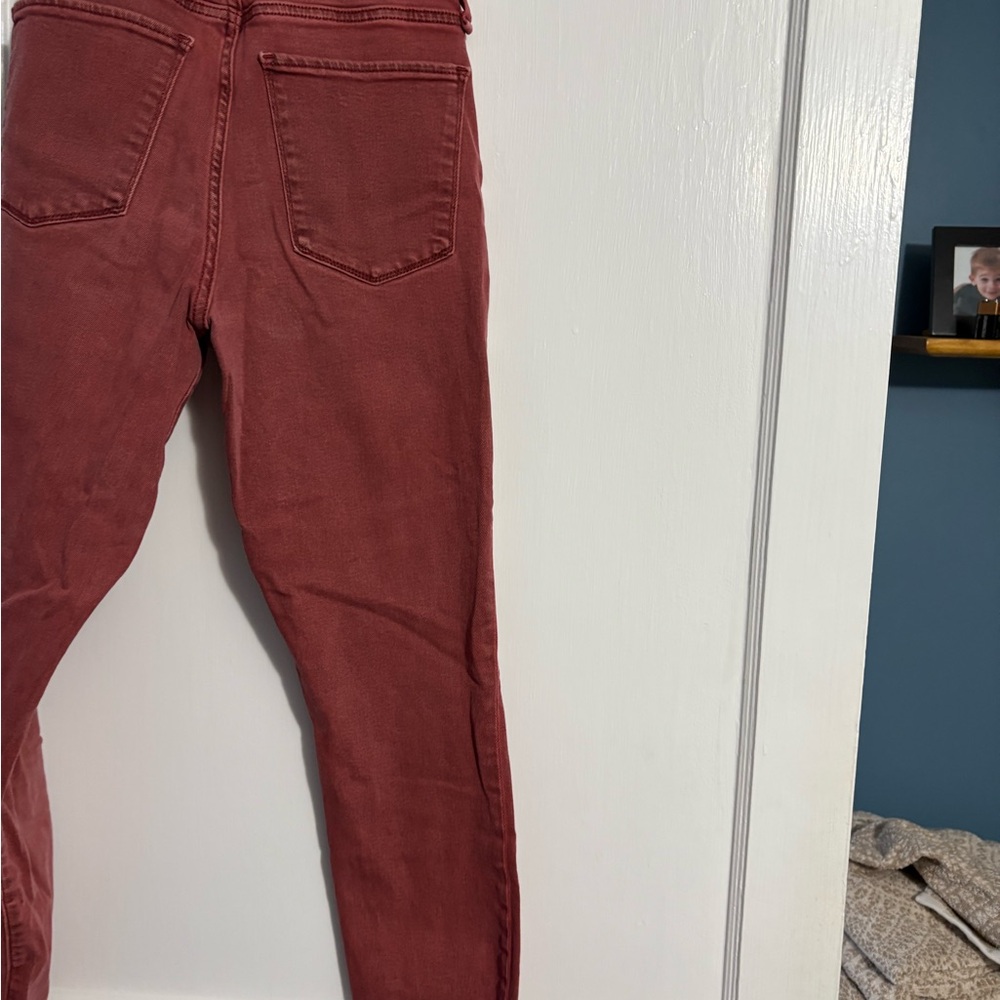 Abercrombie & Fitch Women's Brick Red jeans with raw hem.